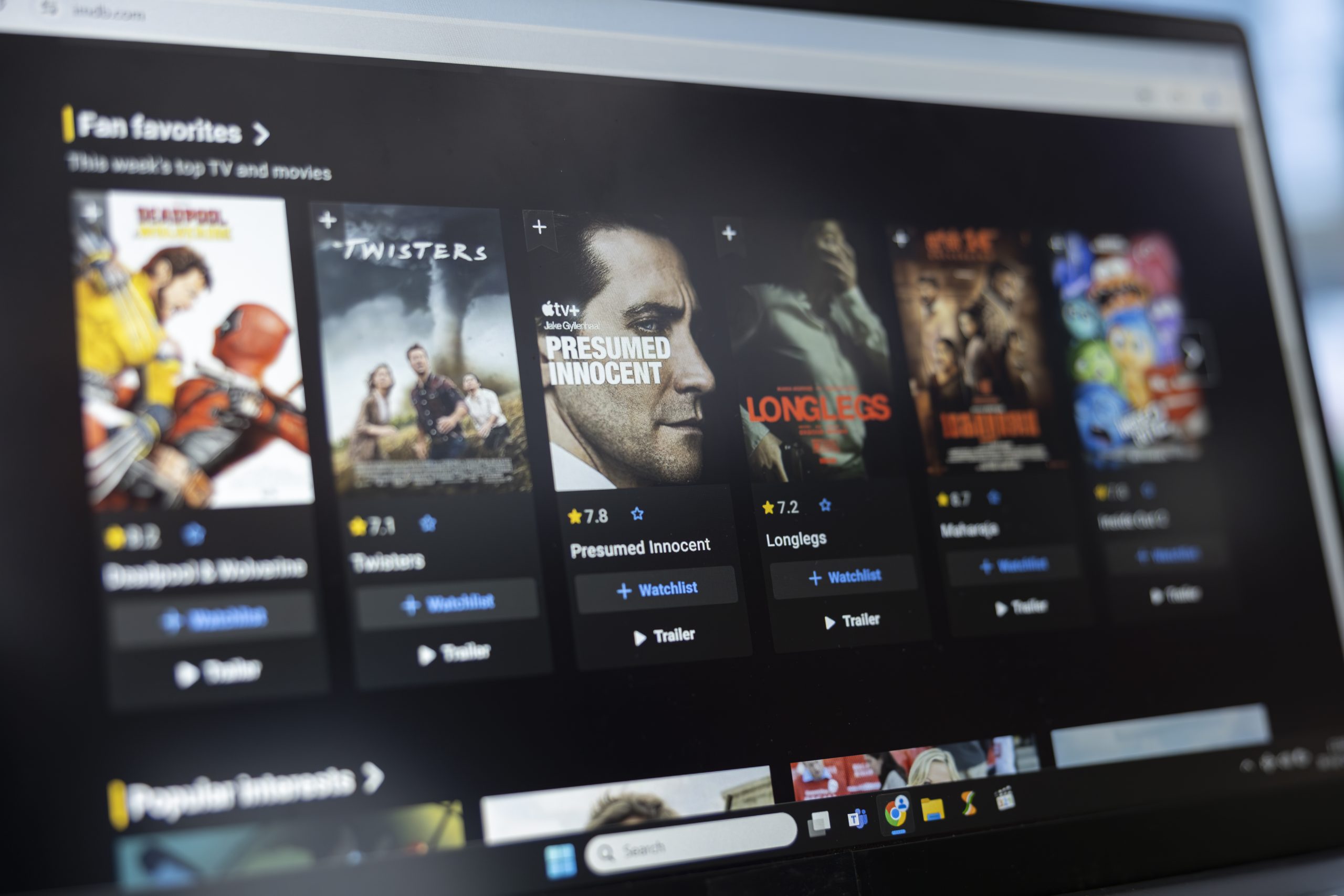 Bucharest, Romania – July 30th 2024 – Movie fan browses the IMDb on demand list